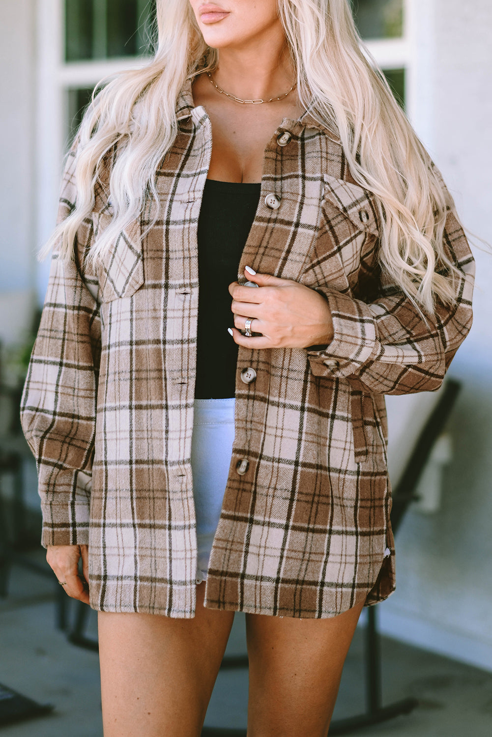 This fab shacket is the perfect finishing touch to your cold-weather look! With classic Plaid, plus convenient and stylish flap pockets, it'll easily tie together any outfit. Dress it up with a top, trousers, or jeans - it's 100% Polyester! Brown bliss awaits at Moodz Boutique.