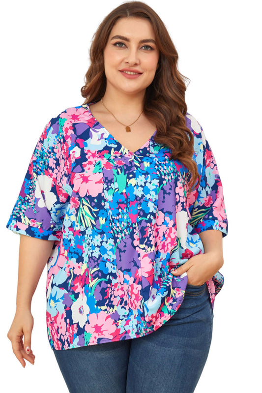 Blusa floral de talla grande con mangas dolman y escote en V en color azul cielo