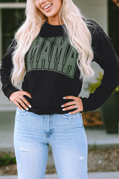 This MAMA graphic pullover sweatshirt is a perfect blend of classic and fashionable. Its loose-fitting drop-shoulder style is perfect for layering over jeans and joggers. Crafted from a cozy blend of 65% Polyester and 35% Cotton, it comes in classic black and is exclusively available from Moodz Boutique.