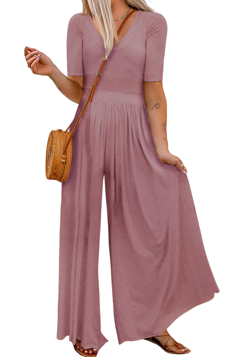 Make a chic statement in this sassy short-sleeved jumpsuit! It flatters your figure with a bodice fit and flare, a cinched waist, and a flowy wide-leg design. This comfy 'n' airy fabric is great for chill days, spruced-up events, and everything in between. 85% Polyester, 15% Elastane – choose from Pink, Light Gray, Black, Red, Gray, or Leopard.