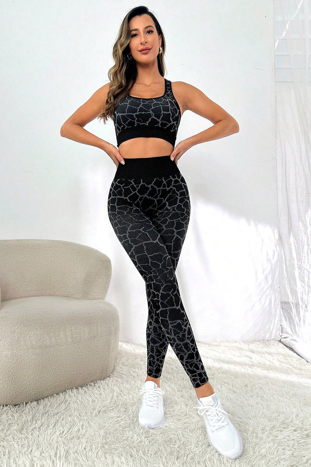 Unleash your wild side with our Animal Print Booty-Boost High Waist Active Set! The racerback top offers the max in mobility and comfort during all activities, while the wide waistband guarantees a snug fit and tummy control. The stylish pattern adds a bold and fashionable flair to your getup, and the booty lift design adds ah-mazing sexiness. Perfect for active lifestyles, this set is perfect for workouts - or just casual loungin'! Comes in Black.