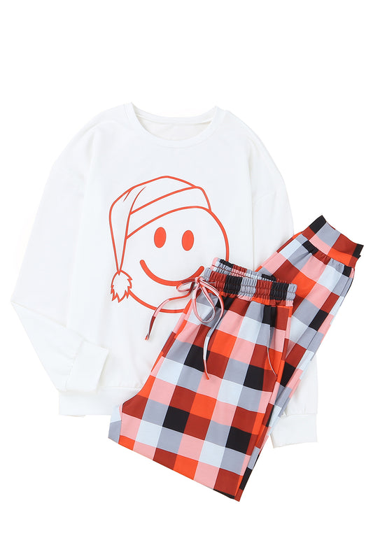 Conjunto de estar por casa con pantalón a cuadros y top con estampado de carita sonriente de Navidad blanca