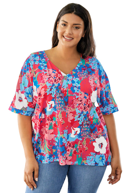 Blusa floral de talla grande con mangas dolman y escote en V en color azul cielo