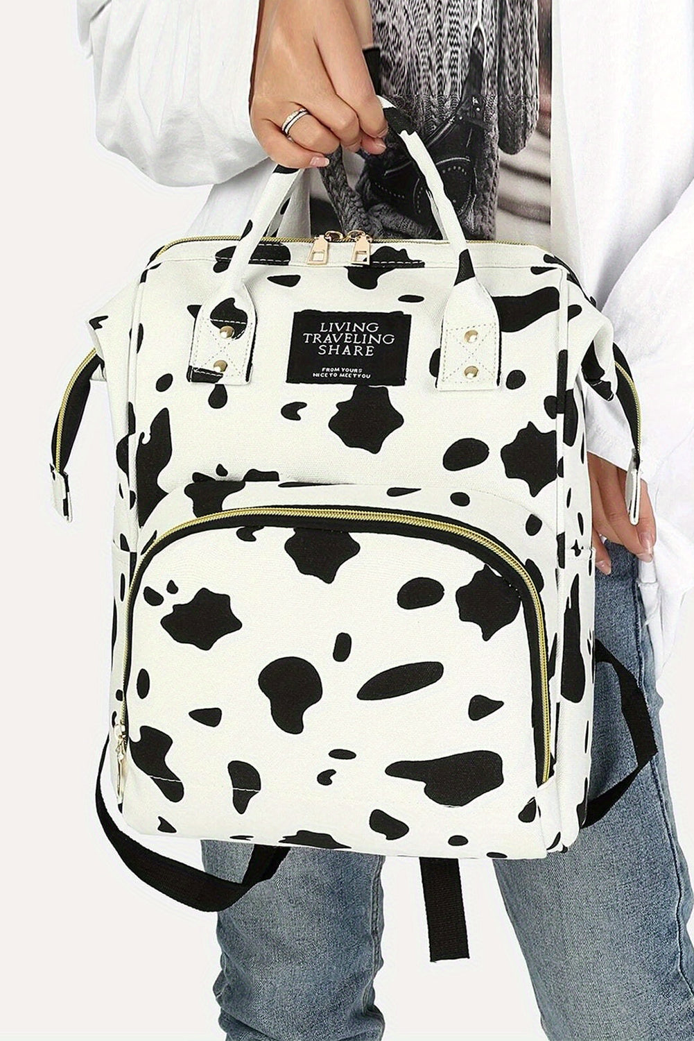 Mochila de lona con múltiples bolsillos y estampado de lunares de vaca en blanco brillante