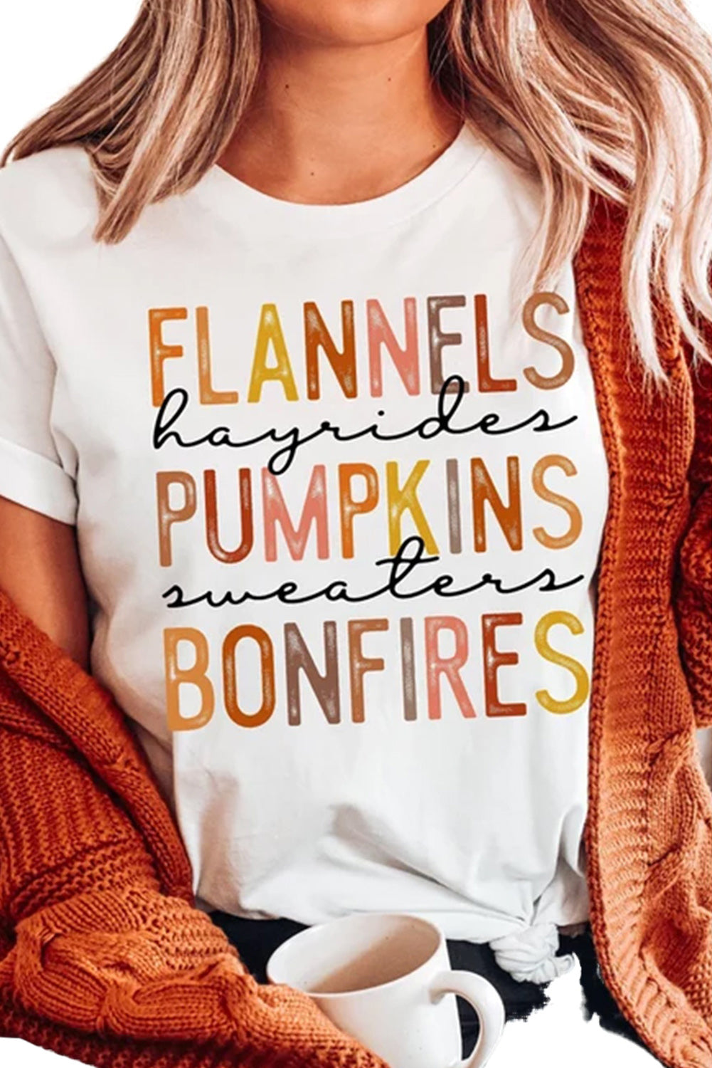 Welcome to your perfect getaway spot! Our Hayrides, Pumpkins, Sweaters, Bonfires Tee stages you in comfort for a night of outdoor fun. Hayrides, pumpkins, sweaters, bonfires, nostalgia—all elements necessary for the best fall-time adventure ever! And, of course, the perfect tee!