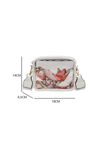 The Clear PVC Leather Strap Crossbody Bag is crafted from top-notch clear PVC, so it's rugged and rainproof! The adjustable leather strap lets you set the bag's size just-so - stylish and practical for every event. Compact and roomy, this bag carries your must-haves - phone, wallet, keys, makeup, and more! Plus, there's a zippy zipper closure to keep everything safely tucked away. Crafted from PU Leather!