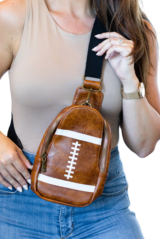 This mini-crossbody is the epitome of sporty chic! Crafted from high-quality PU leather, it's a sleek and sophisticated way to stay in-style. Comfortable and adjustable straps let you customize it to the perfect fit, so you can take your must-haves, wherever you go!