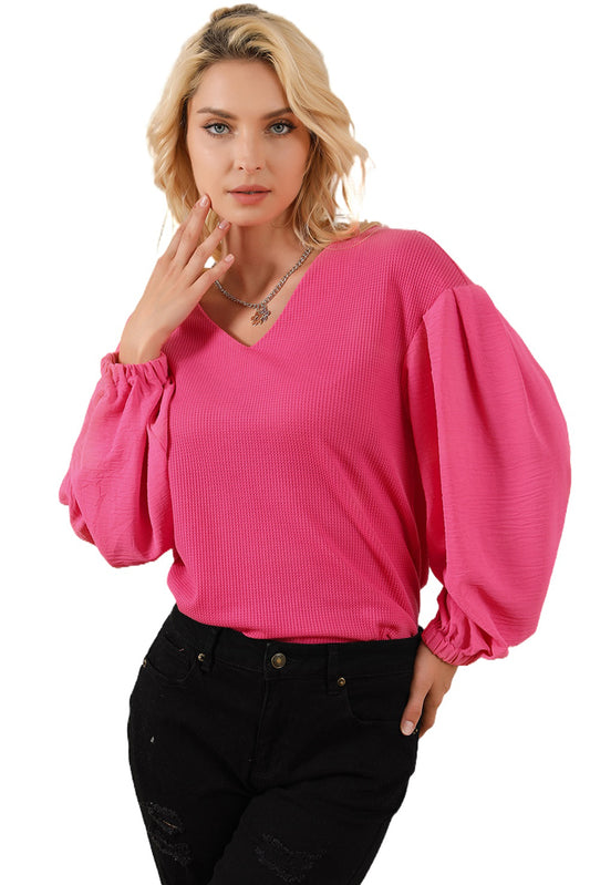 Blusa con escote en V y mangas abullonadas en punto gofre con rosas