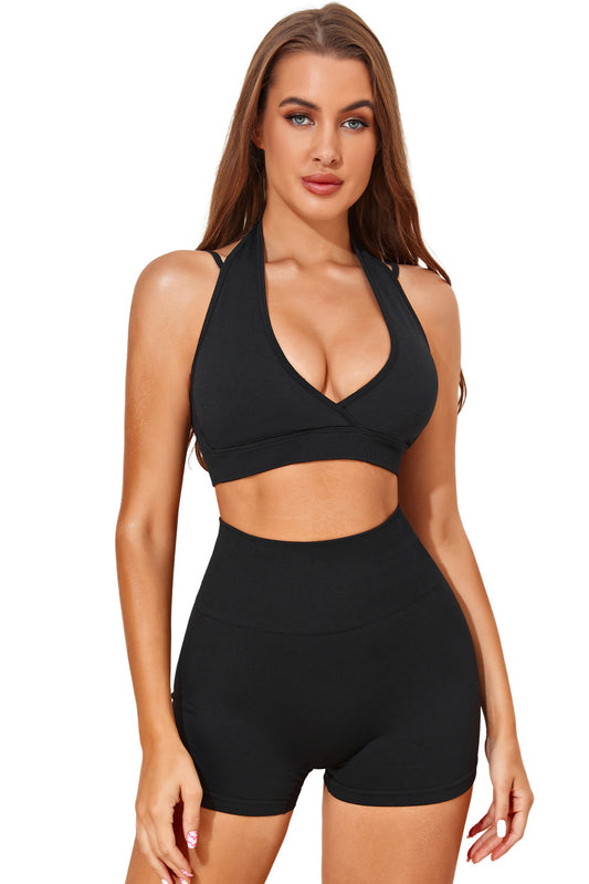 Make an active impact in our stylish V-Neck Halter Top & Shorts Activewear Set. The halter top and deep V-neck is the perfect combination for any workout. The high-waist shorts offer long-lasting comfort and elasticity for yoga, running, cycling, pilates, and beyond! Available in classic black at Moodz Boutique.