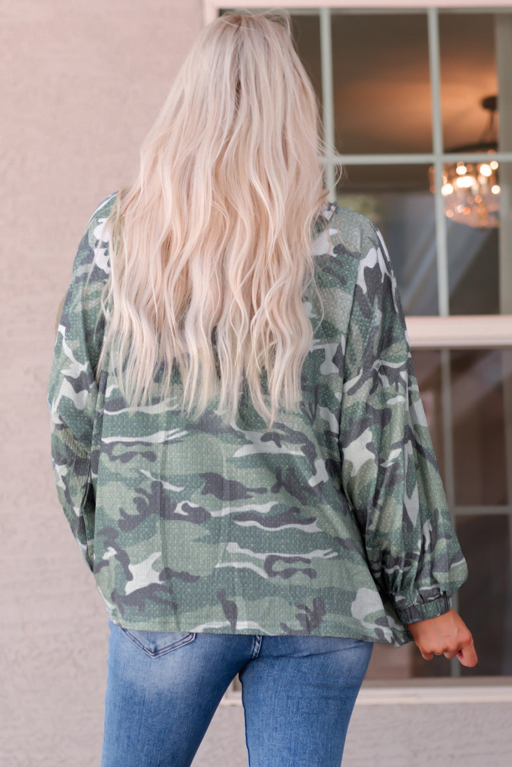 Slip into this oversized, camo-print hoodie! Drop shoulder, wide sleeves, and buttoned neck - not to mention the waffle-knit texture - make it unequivocally fashionable. 95% Polyester, 5% Elastane, so you know it's comfy and available in Green from Moodz Boutique. One hoodie - infinite styling possibilities!