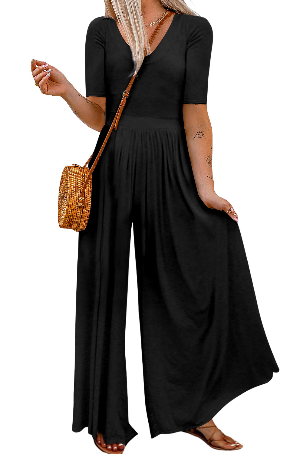 Make a chic statement in this sassy short-sleeved jumpsuit! It flatters your figure with a bodice fit and flare, a cinched waist, and a flowy wide-leg design. This comfy 'n' airy fabric is great for chill days, spruced-up events, and everything in between. 85% Polyester, 15% Elastane – choose from Pink, Light Gray, Black, Red, Gray, or Leopard.