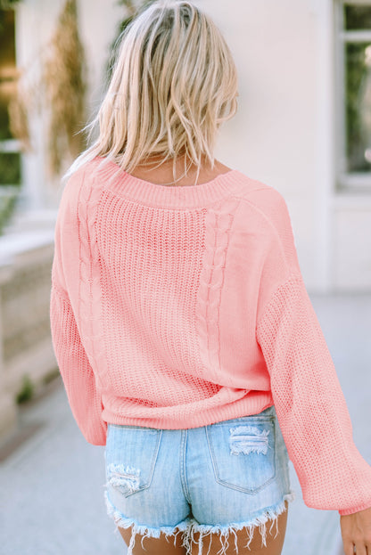 Suéter de punto trenzado con mangas largas y cuello en V de color rosa