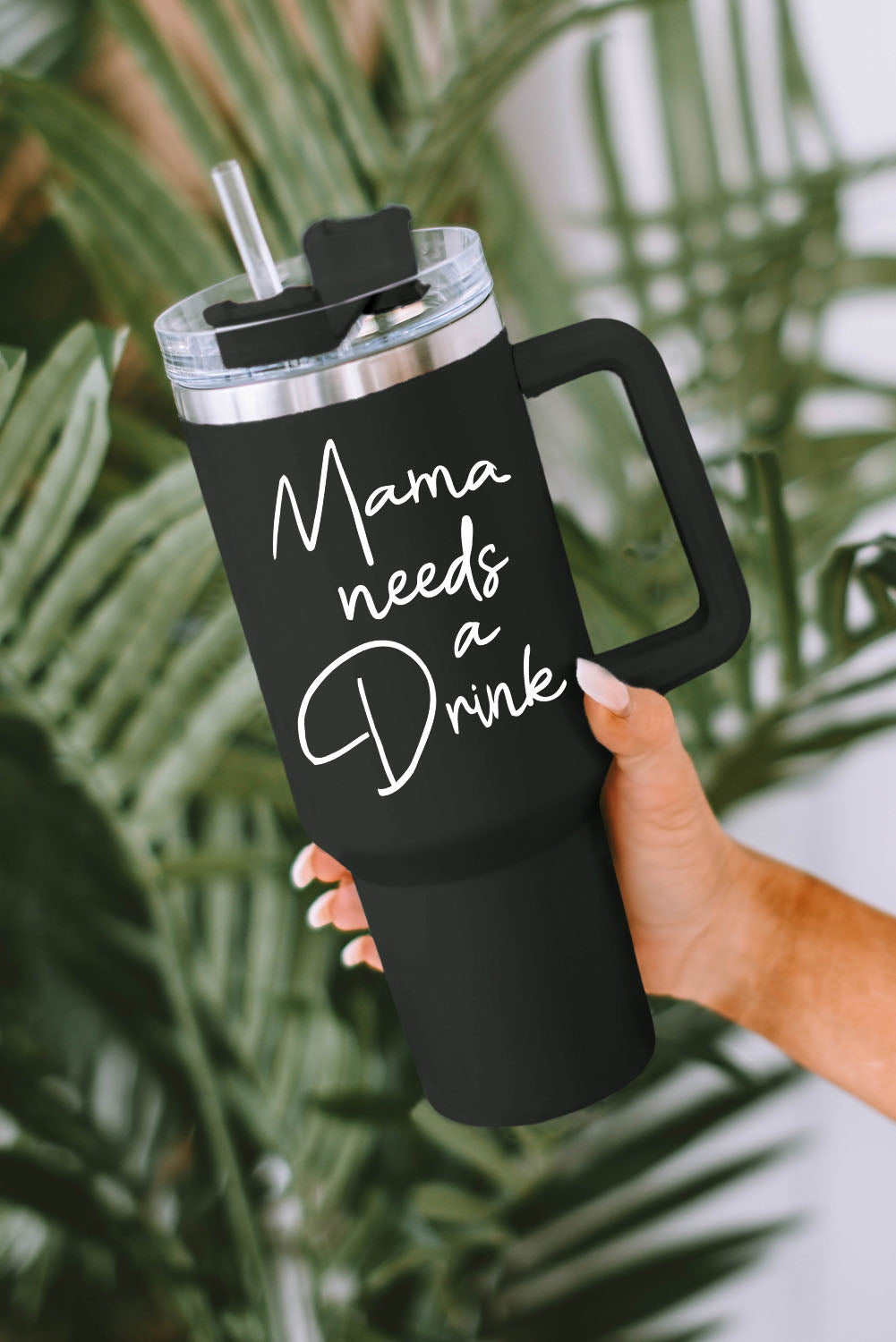 Mama Needs a Drink's stainless steel tumblers are everyday must-haves! Enjoy a firm lid, comfy handle, and matching straw, plus insulation technology for temperature maintenance. Crafted from 95% PC and 5% stainless steel, and available in chic black - get yours now at Moodz Boutique!