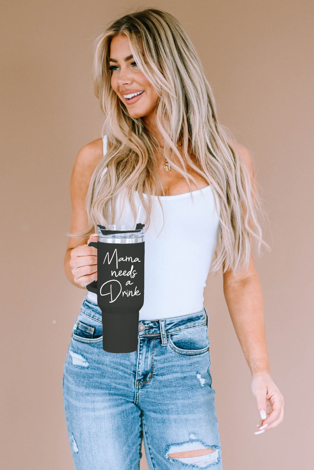 Mama Needs a Drink's stainless steel tumblers are everyday must-haves! Enjoy a firm lid, comfy handle, and matching straw, plus insulation technology for temperature maintenance. Crafted from 95% PC and 5% stainless steel, and available in chic black - get yours now at Moodz Boutique!