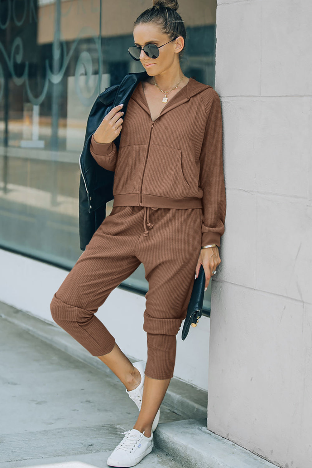 This FIERCE activewear set (holla!) consists of a hoodie and pants, with waffle-fabulous fabric and a zipper/drawstring combo that makes slipping it on or off NBD. Whether you're shopping, stomping up a hill, or scoring a goal, this 'fit pairs perfectly with a pair of sneaks. Brown or Gray, 95% Polyester, 5% Elastane - what's not to love?