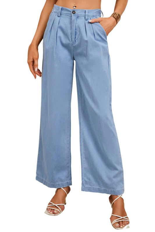 These chambray pants are perfect for an effortless, yet fab look. The high-waisted design makes 'em a cinch to slip on, while the elastic silhouette ensures you'll stay comfy. Plus, the wide-leg design enhances the slimming effect. And the pleats at the front add some serious pizzazz. Not to mention, they boast functional pockets. 100% cotton construction in sky blue. Ta-da!