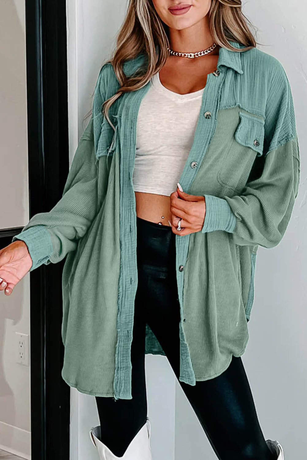 This cozy shacket is perfect for cooler weather! With its flap pockets and textured design, our Green Textured Tunic Shacket adds trendy, timeless style. Crafted from 95% Polyester and 5% Elastane, the shacket from Moodz Boutique will keep you snug and stylish all season long!