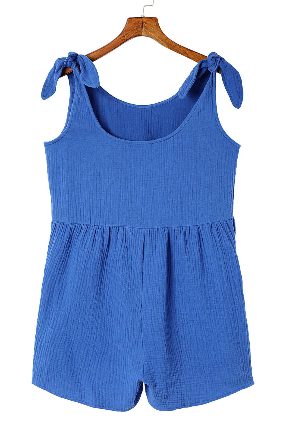 This romper is luxe and lightweight—ideal for sunny-day adventures! Featuring a scoop neck and back, plus raw seam details on the side pockets, you can look as good as you feel. Cinch it up with the adjustable tie straps and channel those playful, breezy vibes. Just add sandals and a statement necklace and you're summer-ready in style. Cotton fabric.