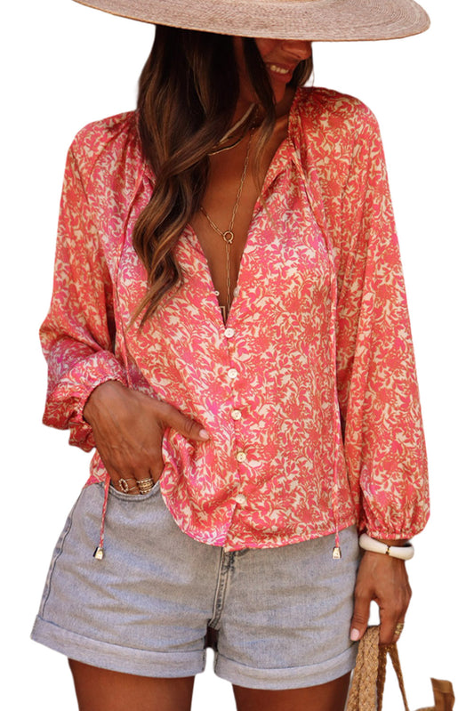 Camisa floral con mangas abullonadas y cordones 