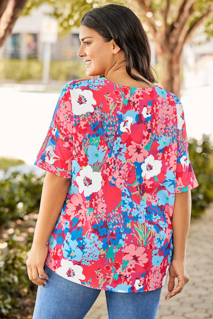 Blusa floral de talla grande con mangas dolman y escote en V en color azul cielo