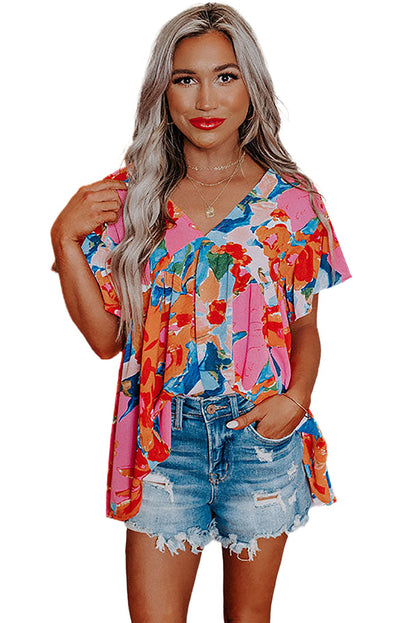 Blusa con escote en V y estampado floral abstracto en rojo 