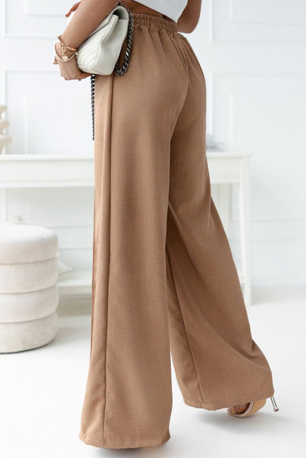 Unleash supreme comfort with these elastic waistband Pants! Show off your chic sense of style with the wide-leg design. Flaunt your long legs with the high-waist cut. Quality materials ensure long-lived wear - 65% Viscose, 30% Polyester, and 5% Elastane. Rock this khaki-hued look.