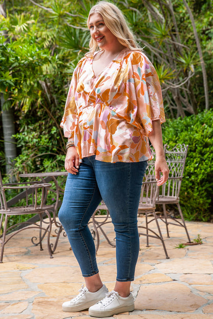 Blusa peplum con escote en V y estampado floral en color naranja de talla grande 