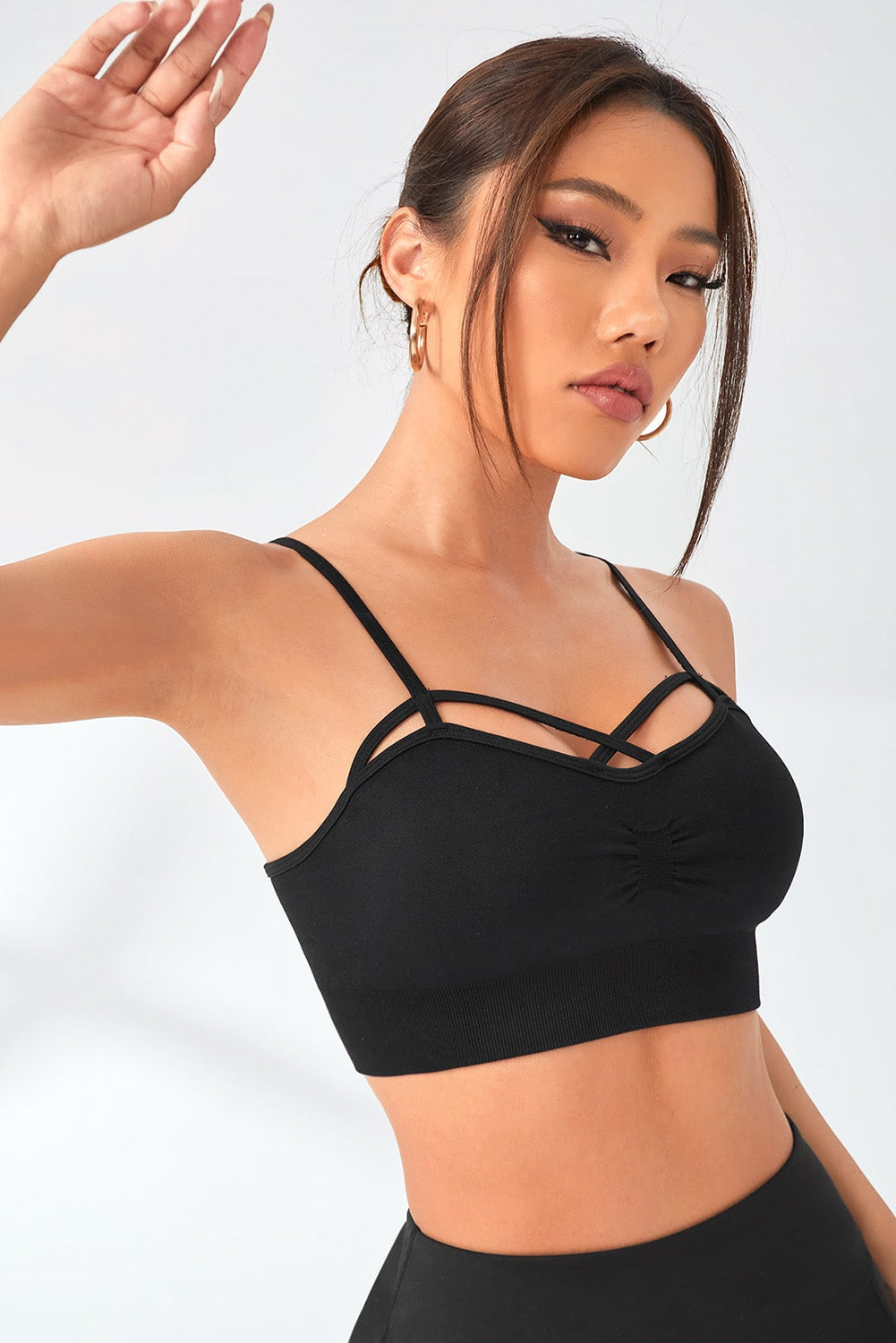 This activewear crop top features an envy-worthy crisscross front and a figure-hugging fit that offers you flexible comfort during your gym workouts. Not only that, it's also got a slight ruched detail that adds an extra chic, ribbed spin! Ready to own it? It's available in black and made of 90% polyamide and 10% elastane.