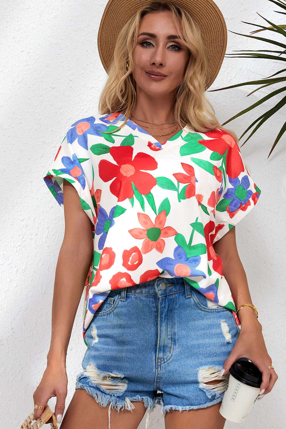 Blusa con escote en V y flores 