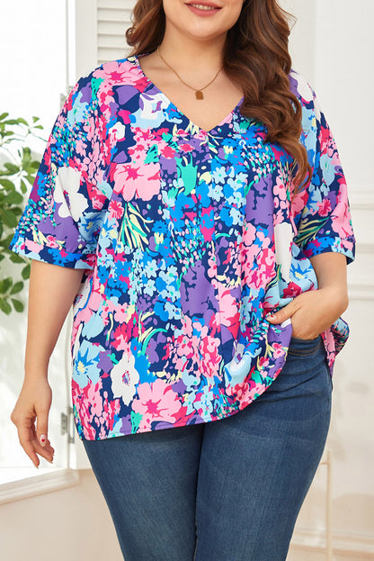 Blusa floral de talla grande con mangas dolman y escote en V en color azul cielo