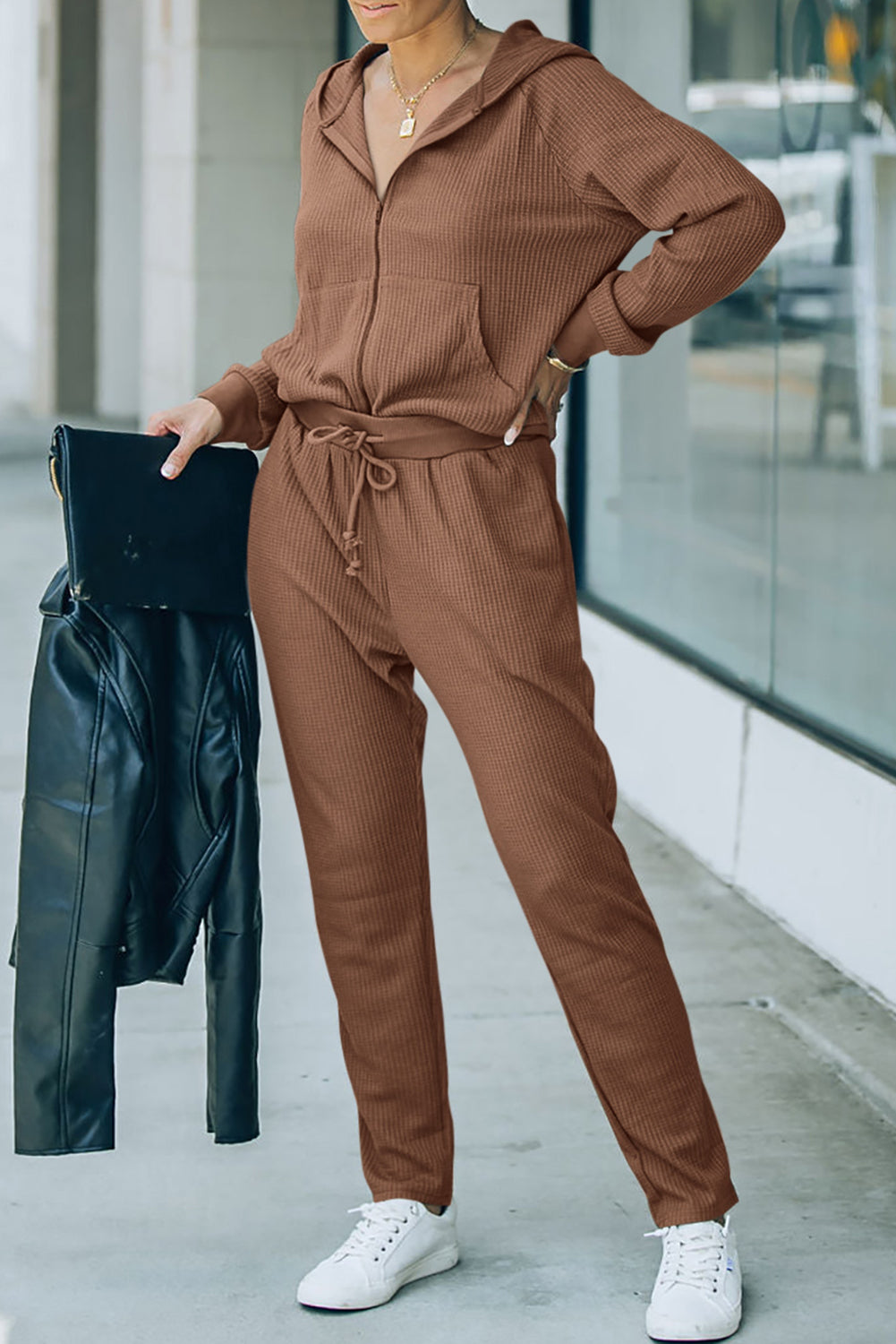 This FIERCE activewear set (holla!) consists of a hoodie and pants, with waffle-fabulous fabric and a zipper/drawstring combo that makes slipping it on or off NBD. Whether you're shopping, stomping up a hill, or scoring a goal, this 'fit pairs perfectly with a pair of sneaks. Brown or Gray, 95% Polyester, 5% Elastane - what's not to love?