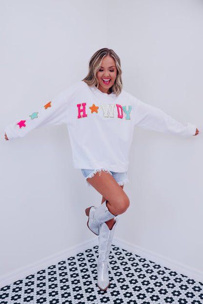 Vamp up your wardrobe with this fun pullover sweatshirt! The dazzling "HOWDY" graphic gives it a touch of pizzazz, and the star patterns on the sleeves make it extra darling. Made of 65% Polyester and 35% Cotton, you can choose from Black or White. Moodz Boutique has you covered!