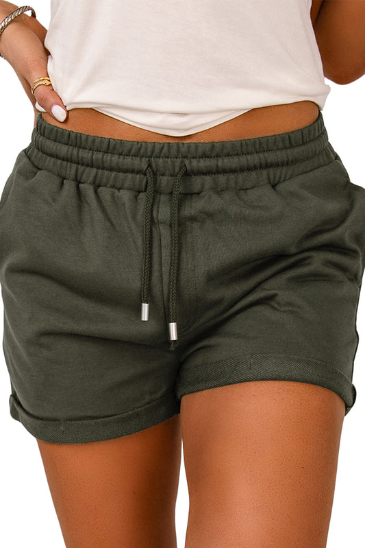 Score these Tie Waist Cuffed Lounge Shorts for major style points! They're timeless—they'll never go out of fashion. Plus, pockets on the sides make 'em great for carrying must-haves like keys and phone. We know you'll swoon over the lightweight feel and the oh-so-soft fabric—75% Polyester 25% Cotton in colors like Green, Gray, and Black.