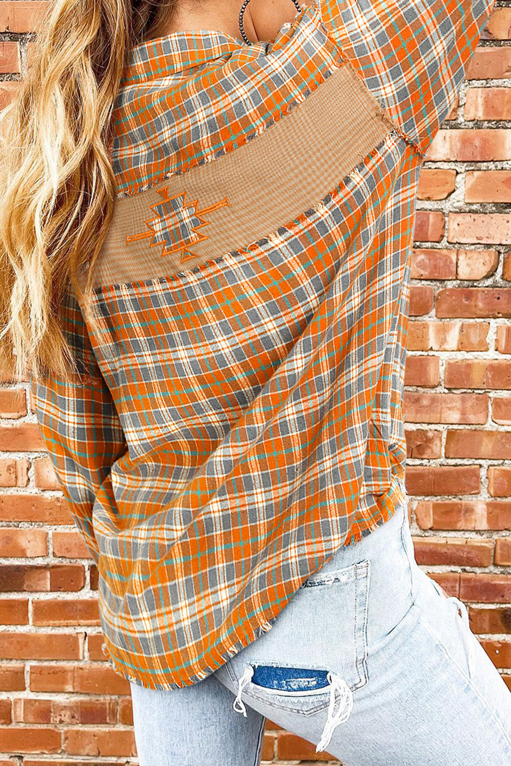 Embark on the boldest of fashion journeys with the Button-Down Plaid Shacket. Dive into the deep waters of adventure with an Aztec embroidered patch on the back. This style isn't afraid to get a bit wild with exposed seams and frayed details. The button-up style, two chest pockets, and collared 100% Cotton make it top-of-the-line. Put your best foot forward in this Mooodz Boutique exclusive!