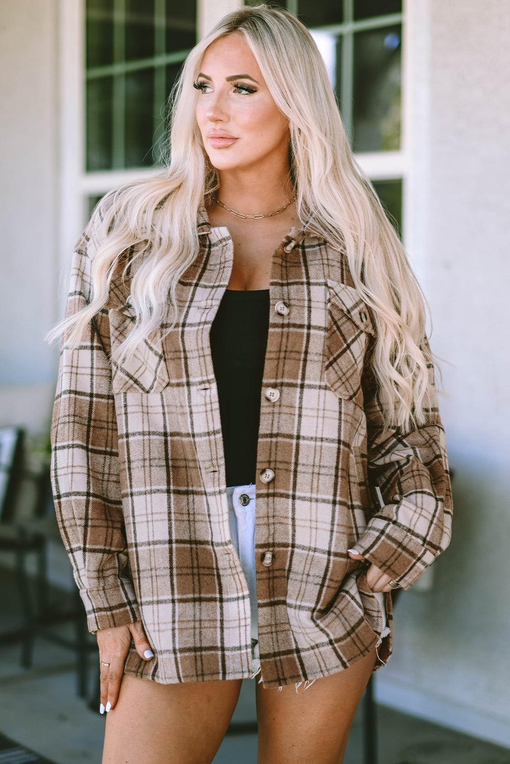 This fab shacket is the perfect finishing touch to your cold-weather look! With classic Plaid, plus convenient and stylish flap pockets, it'll easily tie together any outfit. Dress it up with a top, trousers, or jeans - it's 100% Polyester! Brown bliss awaits at Moodz Boutique.