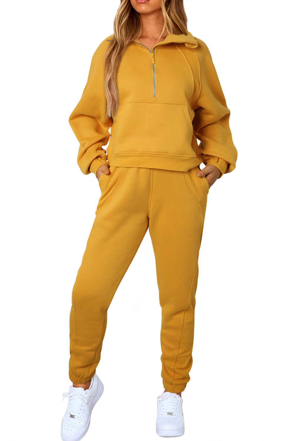  Our Sweatshirt and Sweatpants Activewear Set is just the thing for casual get-togethers or simply kicking back at home. With a kangaroo pocket and half zip for easy breezy wear, you'll find just the right fit. It's made from high-quality, breathable fabrics so you can stay comfy all day long. Plus, it's 75% Polyester, 25% Cotton - so you know you're getting top-notch quality.