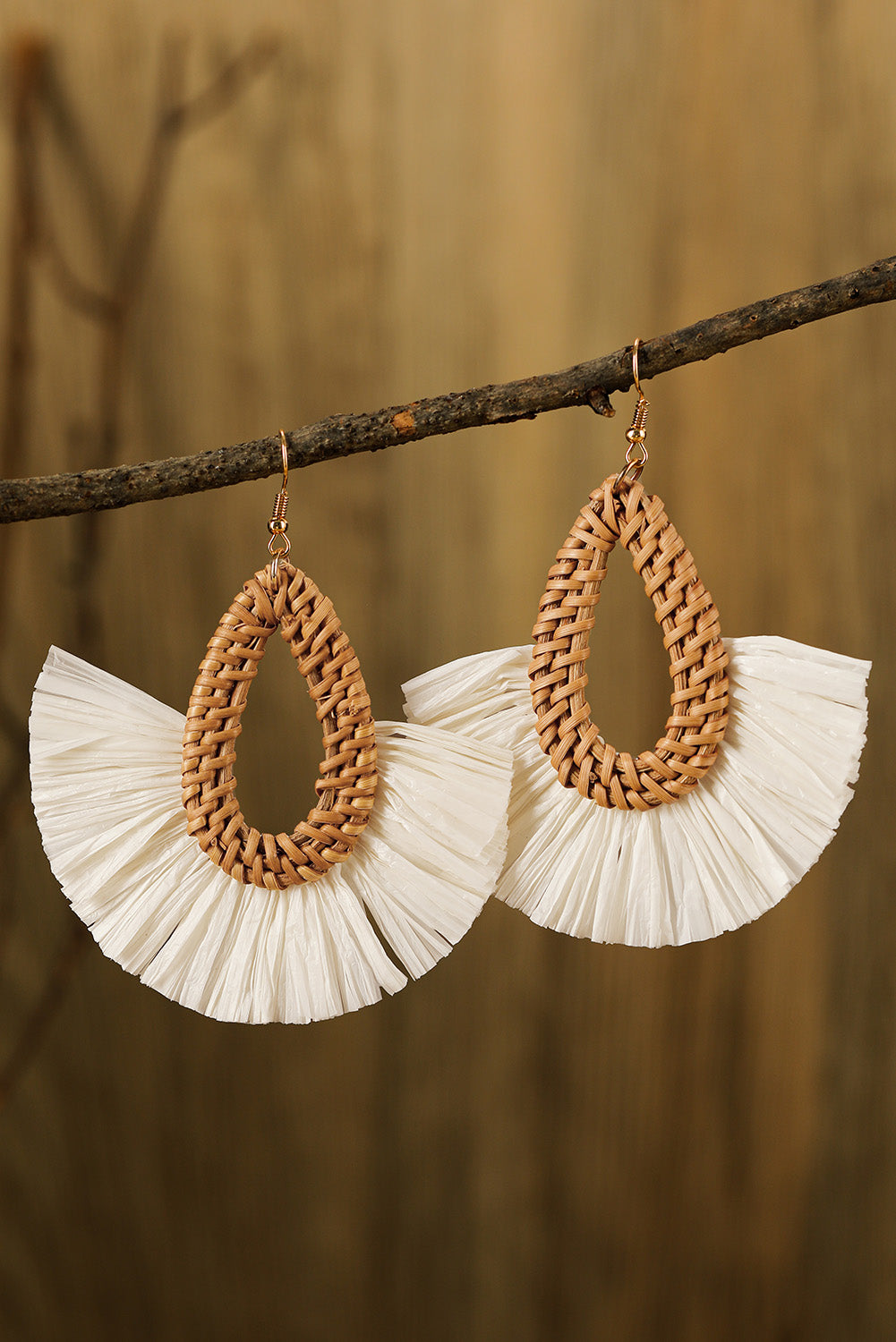 Elevate any look with these bohemian-inspired earrings! The unique semi-circle shape and intricately woven design make them special, while the hollow design keeps them lightweight for all-day comfort. Made of alloy material from Moodz Boutique.