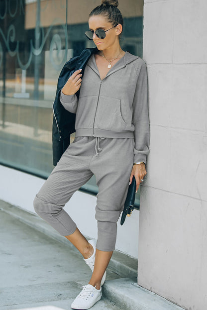 This FIERCE activewear set (holla!) consists of a hoodie and pants, with waffle-fabulous fabric and a zipper/drawstring combo that makes slipping it on or off NBD. Whether you're shopping, stomping up a hill, or scoring a goal, this 'fit pairs perfectly with a pair of sneaks. Brown or Gray, 95% Polyester, 5% Elastane - what's not to love?