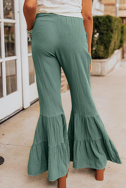 Sashay into the room with these stylish, textured high-waist pants and flaunt those frilly bell bottoms! Comfy with a soft waistband, these pants are ultra-versatile, so you can dress 'em up or down. 100% Cotton in Green, Rose, or classic Black? Talk about a win-win!