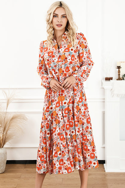 Vestido bohemio amarillo con cuello, manga larga y volantes con estampado floral