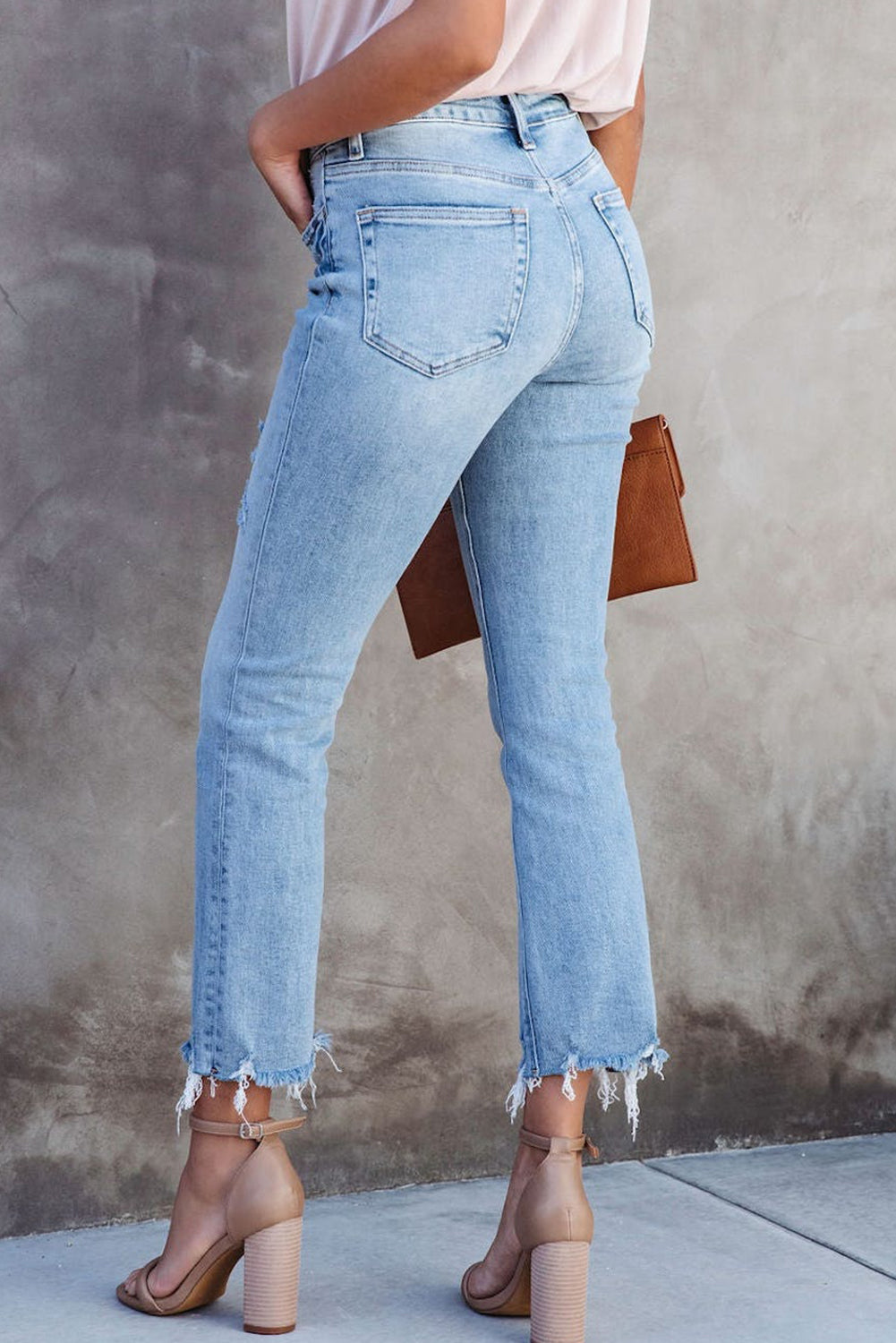 Score serious fashion pts in these sassy-elegant jeans - cropped length with a cross-over waist and raw edge for vintage vibes. Flattering, slenderizing, and oh-so-comfy thanks to the 65% Cotton, 33% Polyester, and 2% Elastane blend.