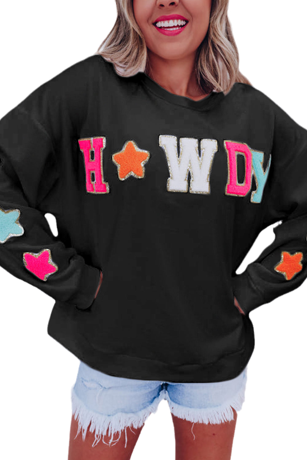 Vamp up your wardrobe with this fun pullover sweatshirt! The dazzling "HOWDY" graphic gives it a touch of pizzazz, and the star patterns on the sleeves make it extra darling. Made of 65% Polyester and 35% Cotton, you can choose from Black or White. Moodz Boutique has you covered!