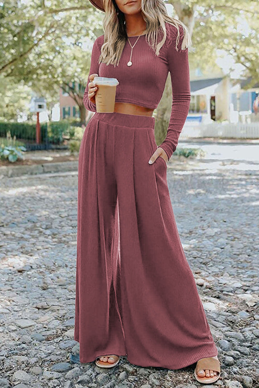 This two-piece set offers outrageous versatility and convenient mixing-and-matching! With the stylish crop top and the trendiest wide legs, you'll make a fashion statement. Plus, the high waist design adds a slimming and flattering effect - it's a total knockout! 65% Polyester, 25% Viscose, 10% Elastane in colors like Pink, Gray, or Black - pick your fave!