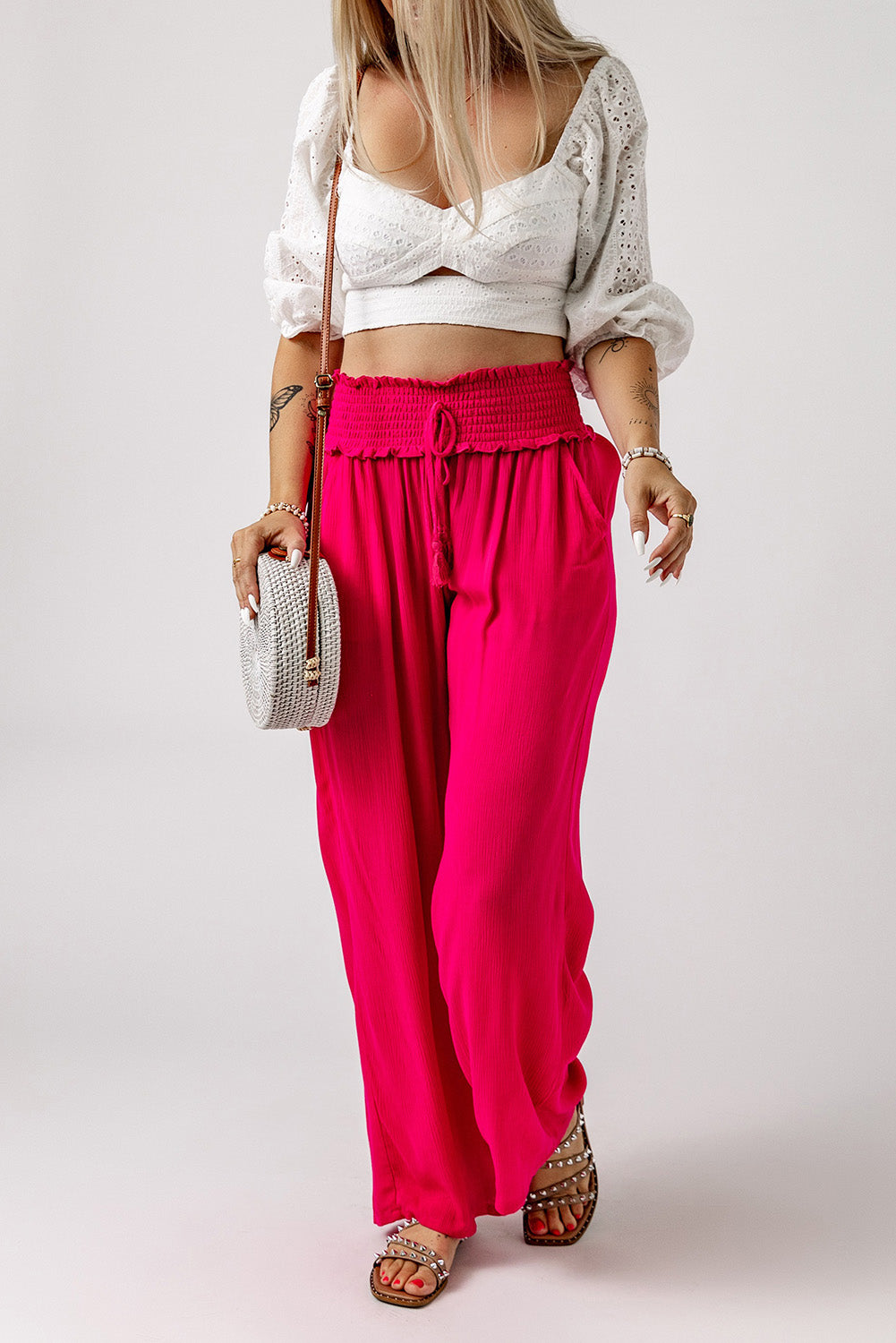 These pants will keep you lookin' sassy and comfy! The smocked waist brings the unique, and they slip on with ease. The wide legs flatter your pins, while the lightweight, 100% viscose fabric's as breezy as it is chic. Rose color--so you can bloom!