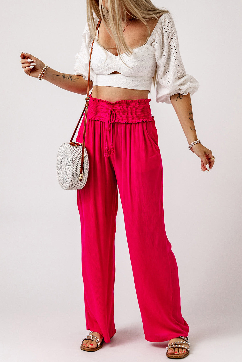 These pants will keep you lookin' sassy and comfy! The smocked waist brings the unique, and they slip on with ease. The wide legs flatter your pins, while the lightweight, 100% viscose fabric's as breezy as it is chic. Rose color--so you can bloom!