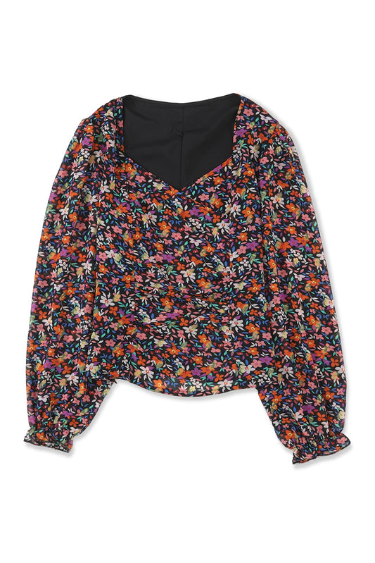 Blusa floral con mangas abullonadas