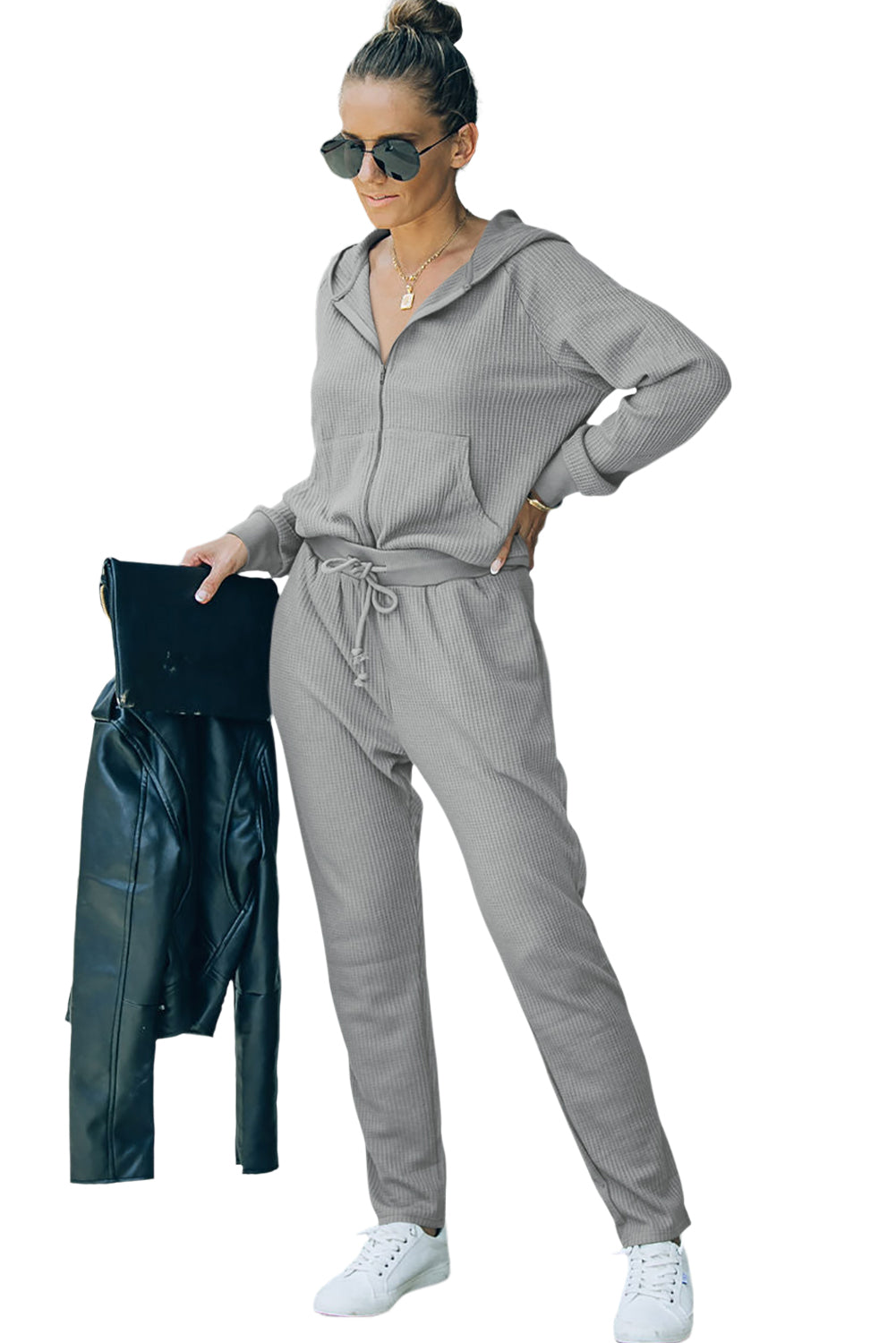 This FIERCE activewear set (holla!) consists of a hoodie and pants, with waffle-fabulous fabric and a zipper/drawstring combo that makes slipping it on or off NBD. Whether you're shopping, stomping up a hill, or scoring a goal, this 'fit pairs perfectly with a pair of sneaks. Brown or Gray, 95% Polyester, 5% Elastane - what's not to love?