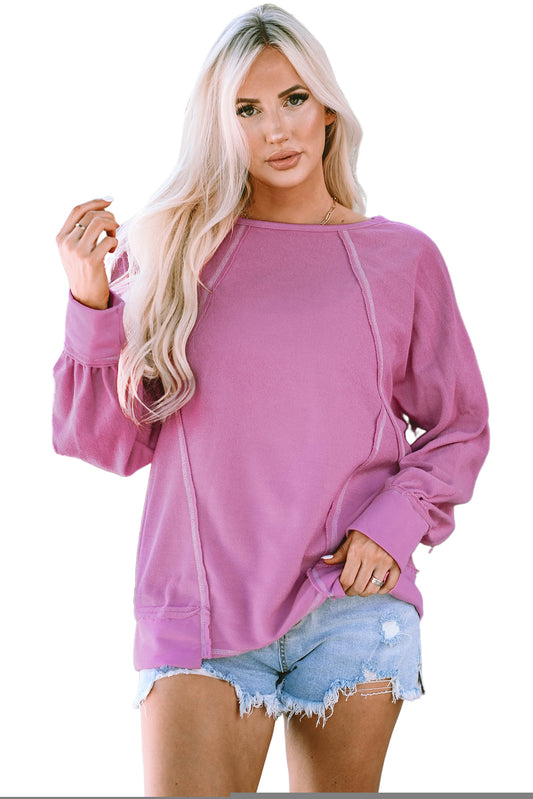 Blusa de manga larga de rizo con costuras expuestas en color rosa