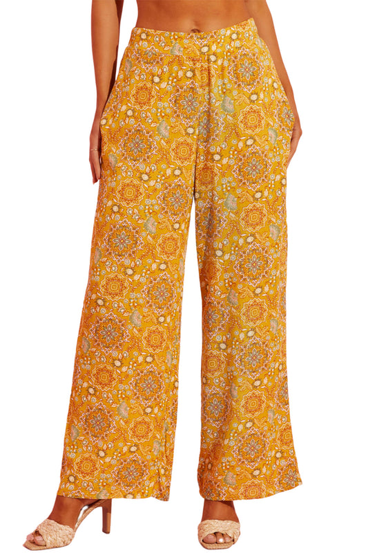 Pantalones anchos con bolsillos y estampado floral bohemio en amarillo 