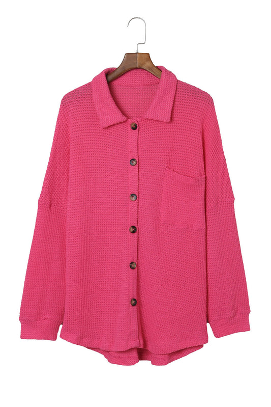 Deck yourself out in this Pink Knit Shirt for effortless cool. Lightweight and textured with Waffle Knit, it features a button-up front, collar, dropped shoulders, and a single pocket - all in a slouchy cut that rounds out at the hem. Dare to be different in 95% Polyester 5% Elastane.